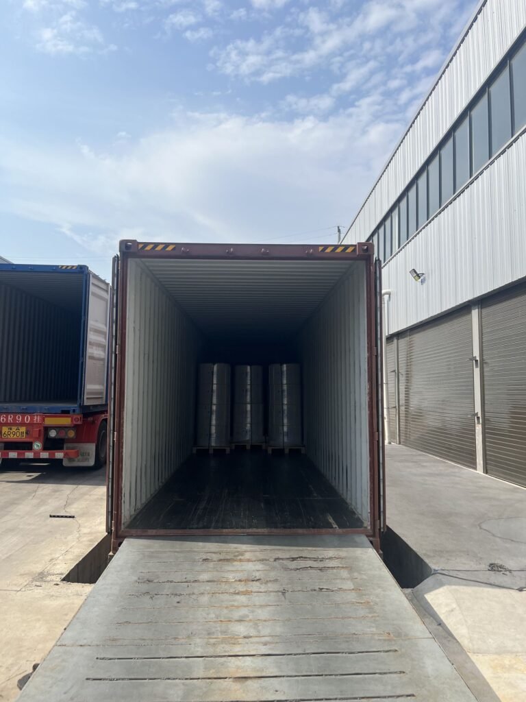 Jumbo rolls loaded into a shipping container
