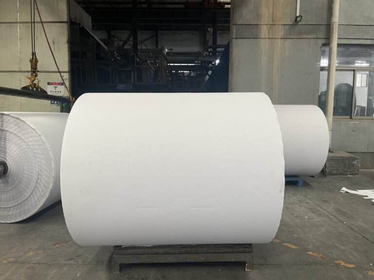 Jumbo thermal paper roll standing on a pallet
