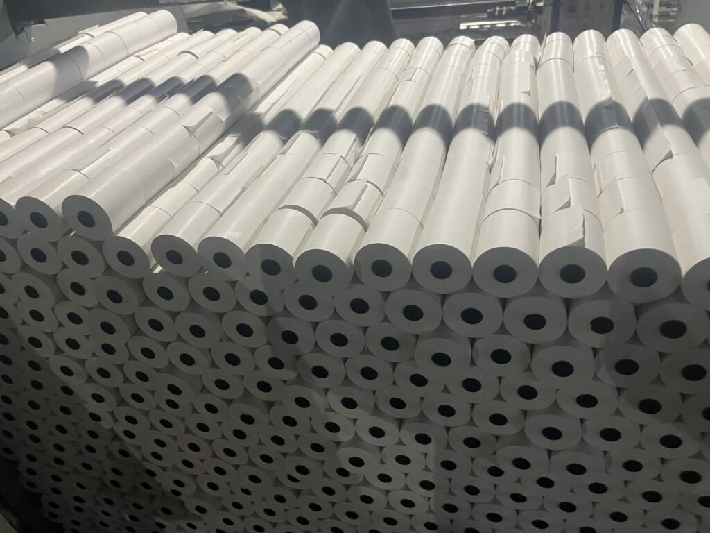 Stacked thermal receipt paper rolls
